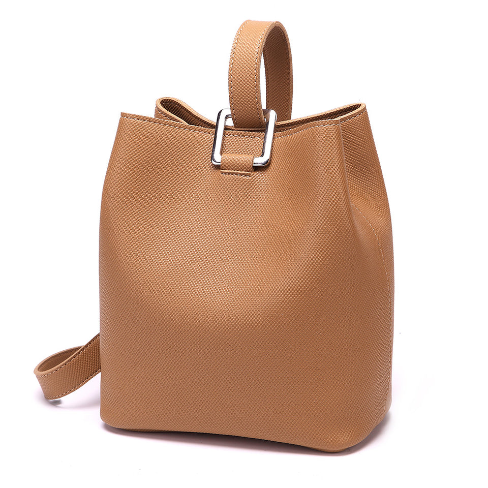Cutout metal hardware faux leather bucket bag in Brown