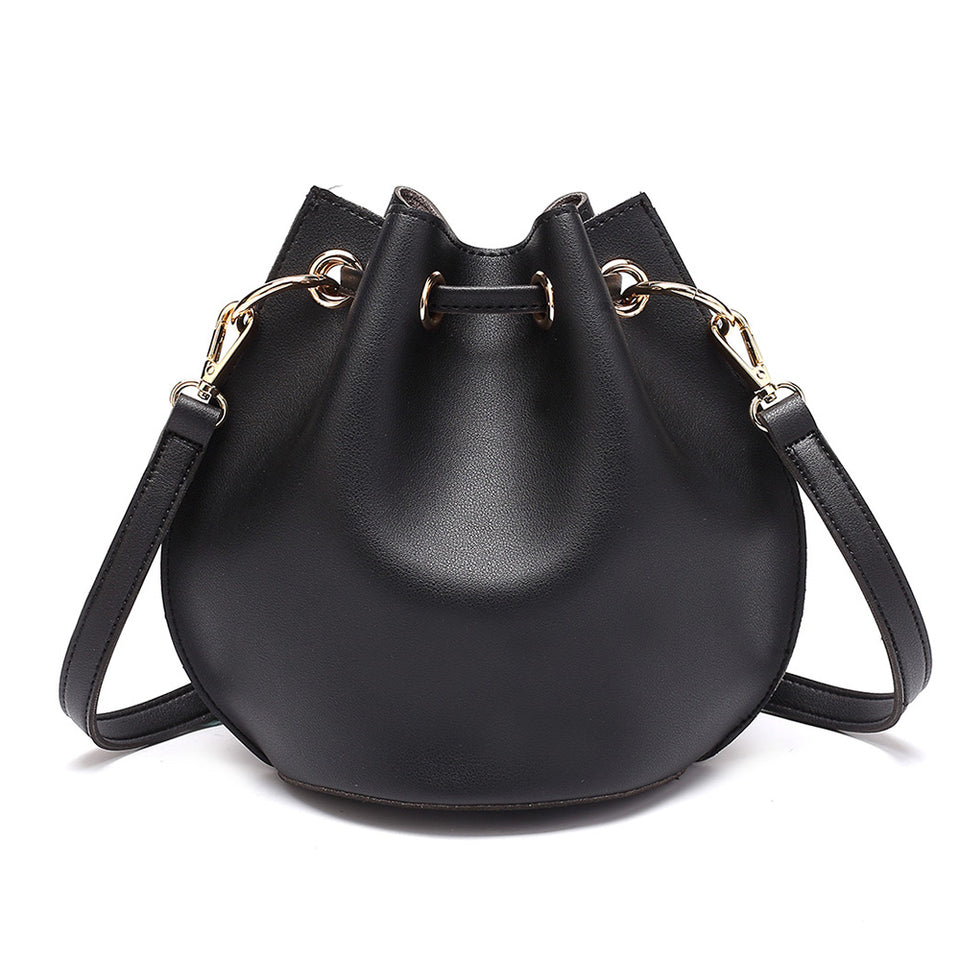 Eyelet drawstring faux leather bucket bag in Black