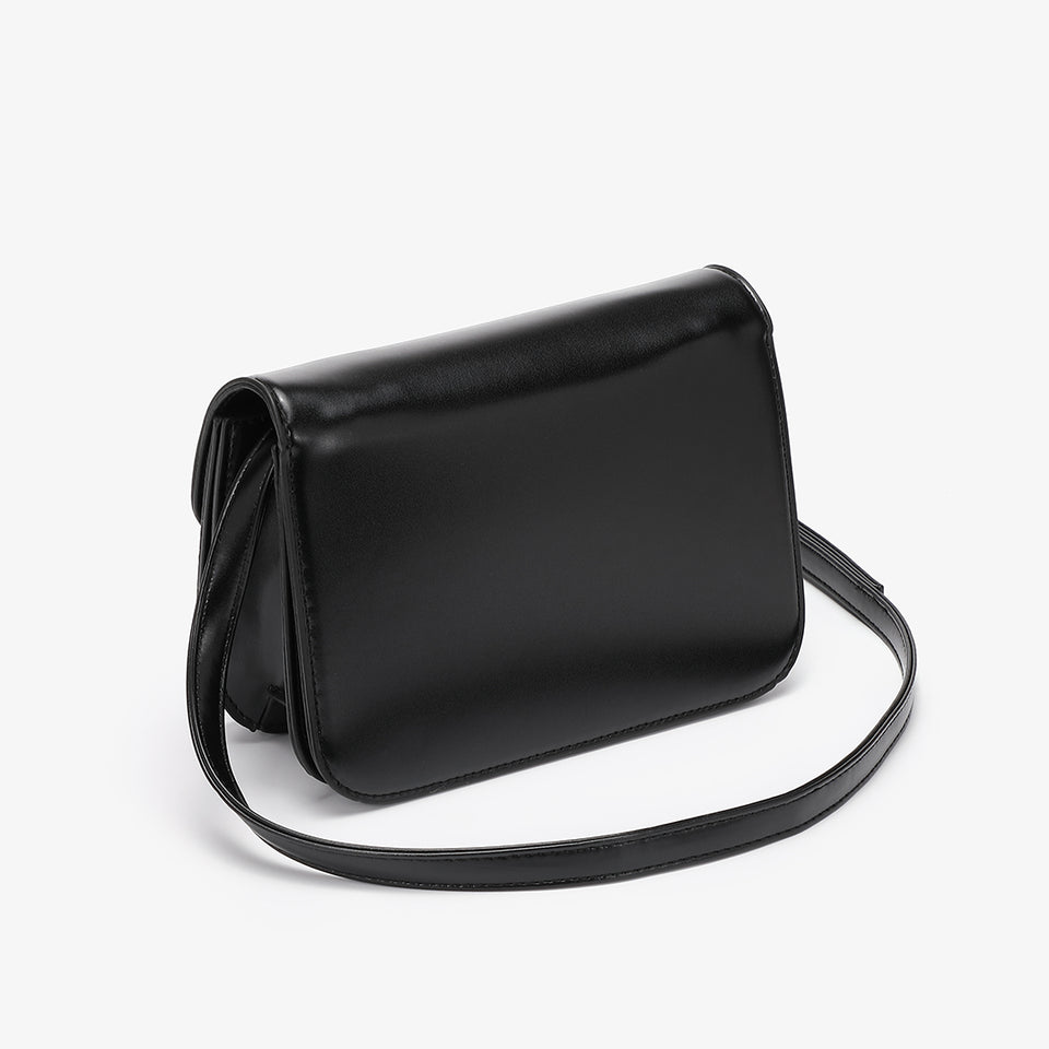 Abstract hardware flap crossbody bag in black